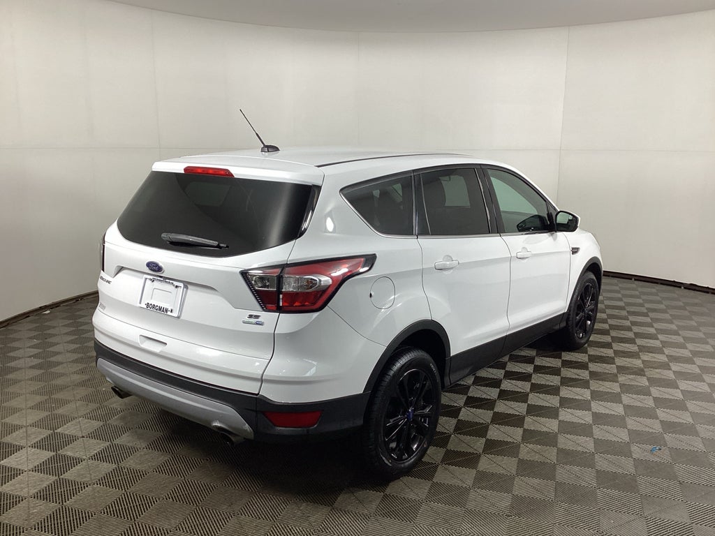 Used 2017 Ford Escape SE with VIN 1FMCU9GD3HUD67666 for sale in Grandville, MI